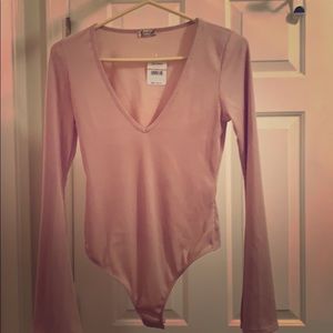 Beautiful dusty rose free people body suit.